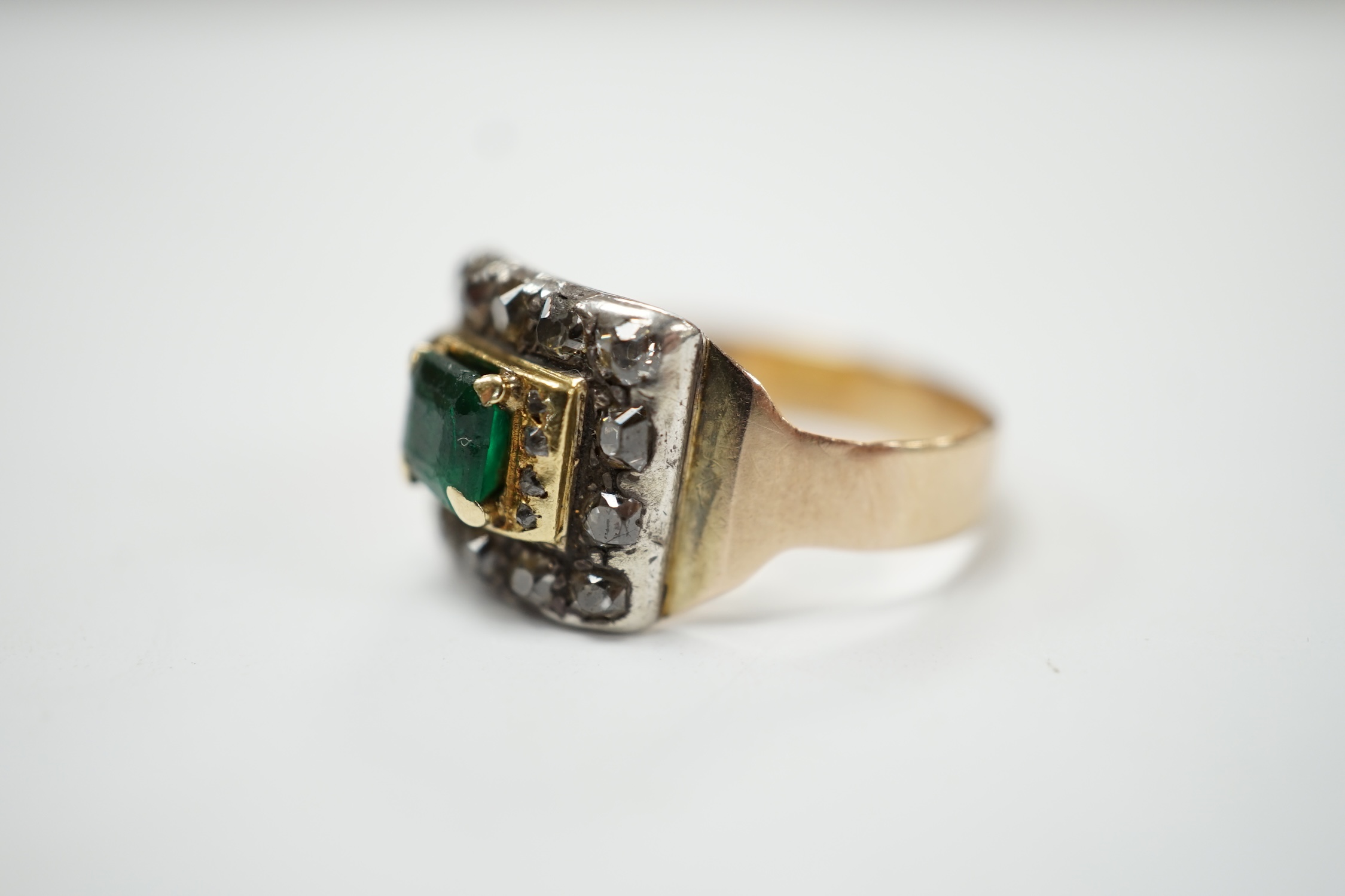 A George III 18ct, emerald and diamond cluster set mourning ring, with engraved inscription, 'H. Goodwin? died 18th Jan, 1790, aged 63', size S, gross weight 5.5 grams. Condition - fair